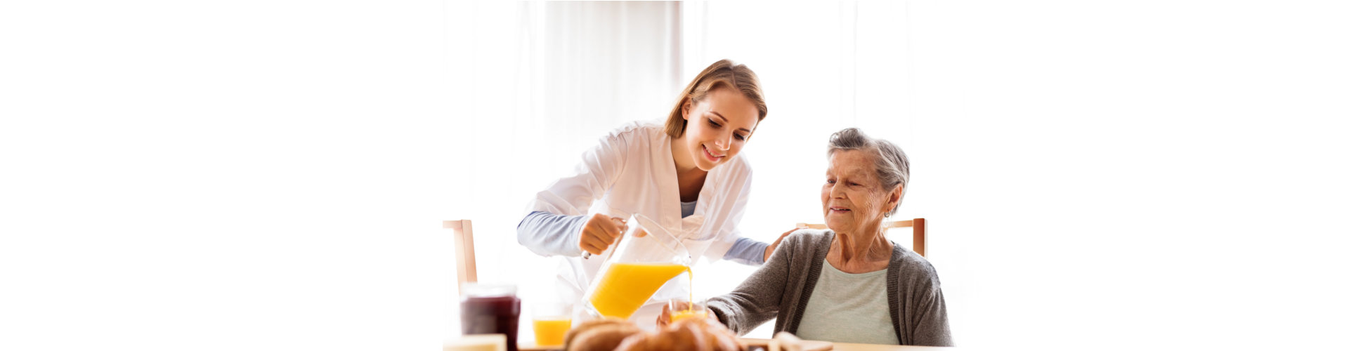 doctor helps an elderly to eat